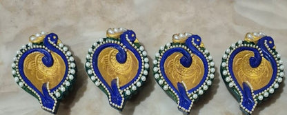 Peacock shaped colorful handcrafted diyas with beads and chains - set of 4