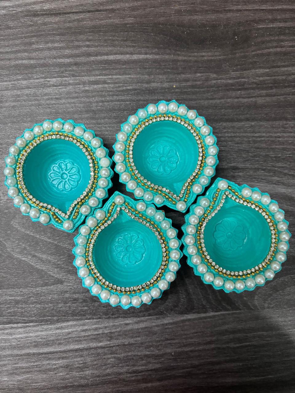 Handcrafted pearl clay diyas - set of 4