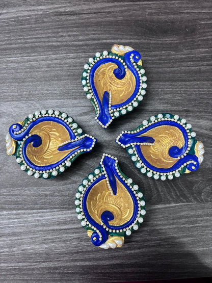 Peacock shaped colorful handcrafted diyas with beads and chains - set of 4