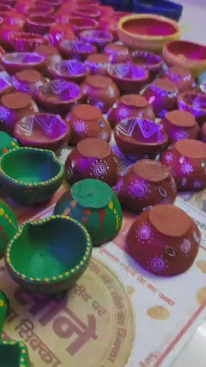 Handpainted small size clay diyas (designs may vary) - Set 0f 12